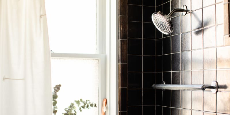 This Viral Waterproof Shower Lamp Is the Key to a Cozy Shower Apartment Therapy